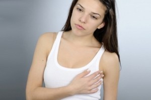 Почему болит грудь перед месячными